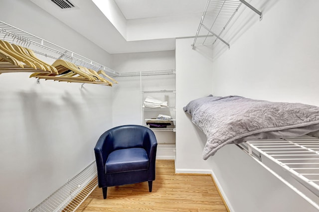 spacious closet featuring hardwood / wood-style floors