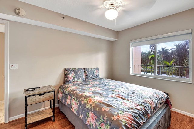 bedroom featuring hardwood / wood-style flooring and ceiling fan