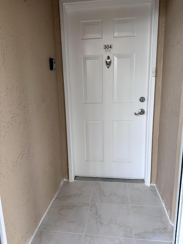 5777 Gemstone Ct Unit 304, Boynton Beach, FL 33437 - property entrance featuring stucco siding
