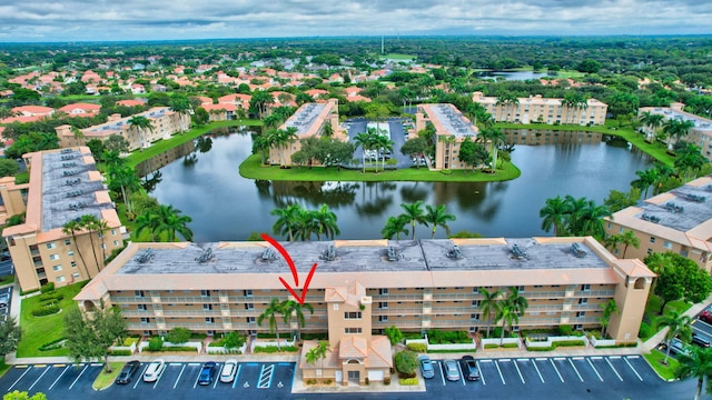 birds eye view of property featuring a water view