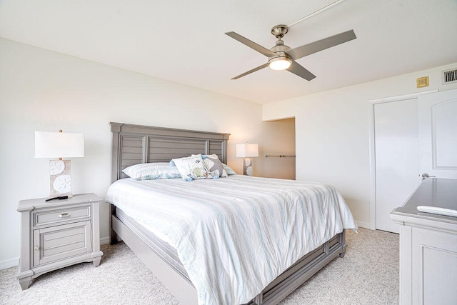 carpeted bedroom featuring ceiling fan