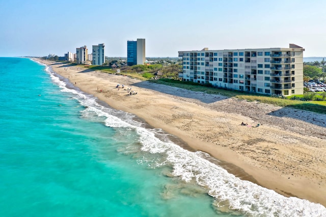 aerial view featuring a water view and a beach view