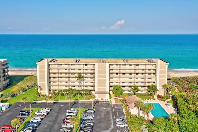 bird's eye view with a view of the beach and a water view