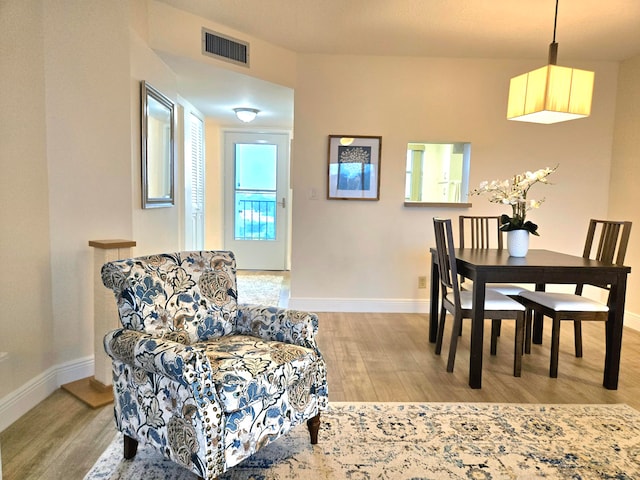 dining room with hardwood / wood-style flooring