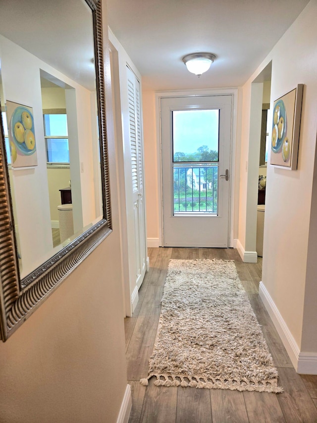 corridor featuring light hardwood / wood-style floors