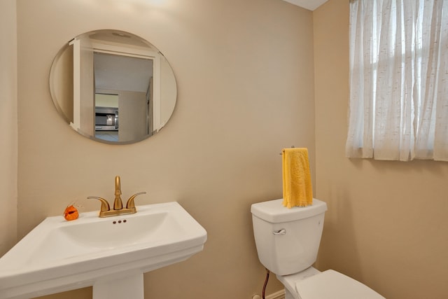 bathroom with sink and toilet