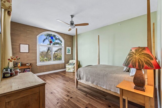 bedroom featuring hardwood / wood-style flooring and ceiling fan