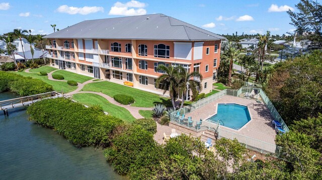 birds eye view of property featuring a water view