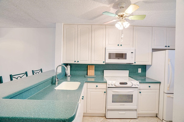 kitchen featuring a kitchen breakfast bar, white appliances, light tile patterned floors, ceiling fan, and sink