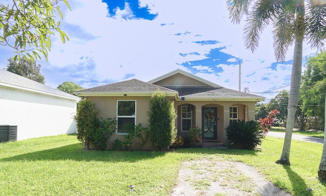 view of front of home with a front lawn