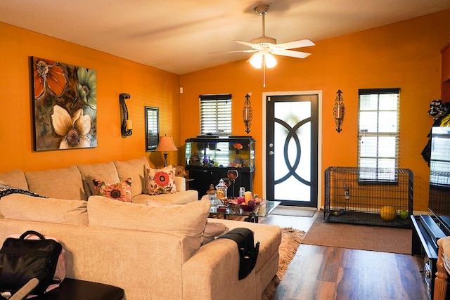 living room featuring lofted ceiling, ceiling fan, hardwood / wood-style flooring, and a healthy amount of sunlight