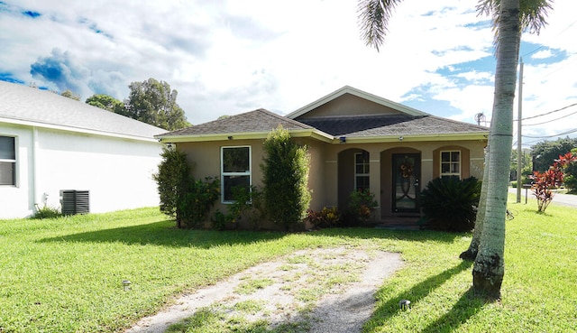 view of front of property with a front lawn