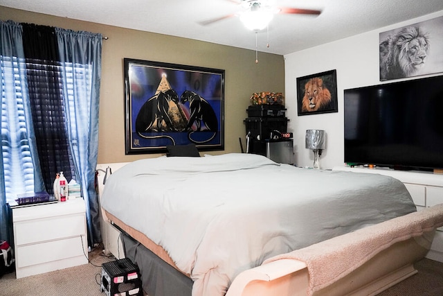 carpeted bedroom featuring ceiling fan and multiple windows