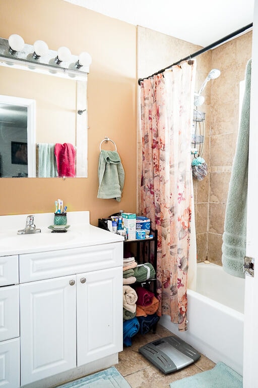 bathroom featuring shower / tub combo, vanity, and tile patterned floors