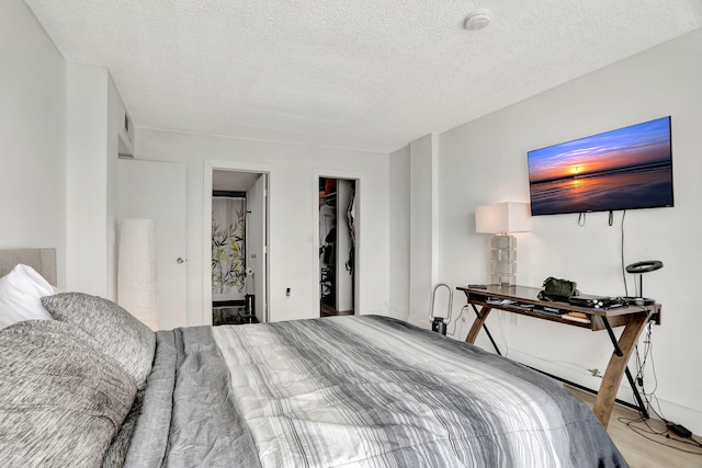 4174 Inverrary Dr Unit 914, Lauderhill, FL 33319 - bedroom with a textured ceiling and a spacious closet