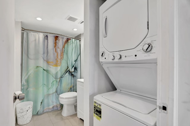 4174 Inverrary Dr Unit 914, Lauderhill, FL 33319 - full bath featuring stacked washer and clothes dryer, tile patterned flooring, a shower with shower curtain, and recessed lighting