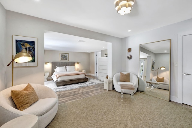 bedroom with hardwood / wood-style flooring