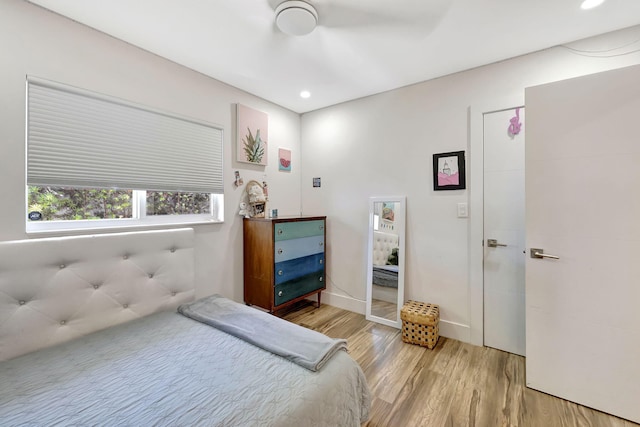 bedroom featuring ceiling fan and light hardwood / wood-style flooring