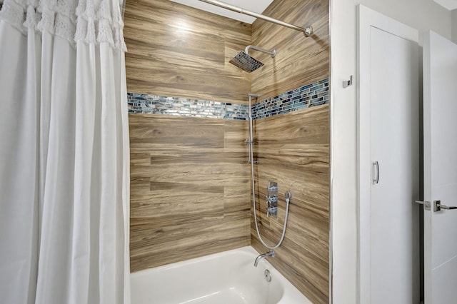 bathroom with shower / bath combo with shower curtain