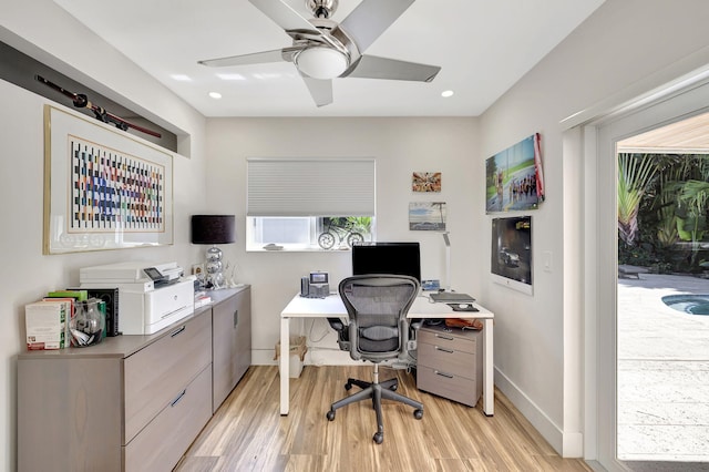 office space with light wood-type flooring and ceiling fan