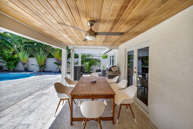 view of patio featuring ceiling fan and french doors