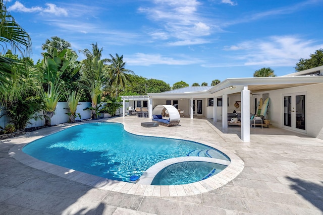 view of pool with an in ground hot tub, french doors, and a patio area