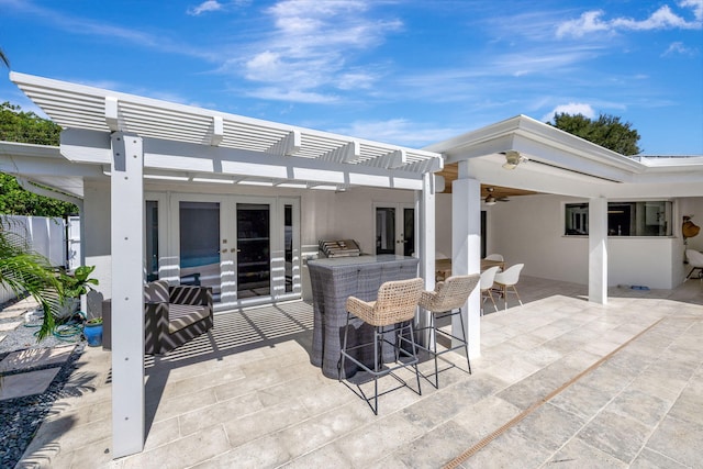 view of patio / terrace featuring ceiling fan and a pergola