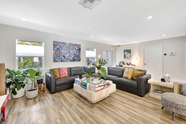 living room with light hardwood / wood-style floors