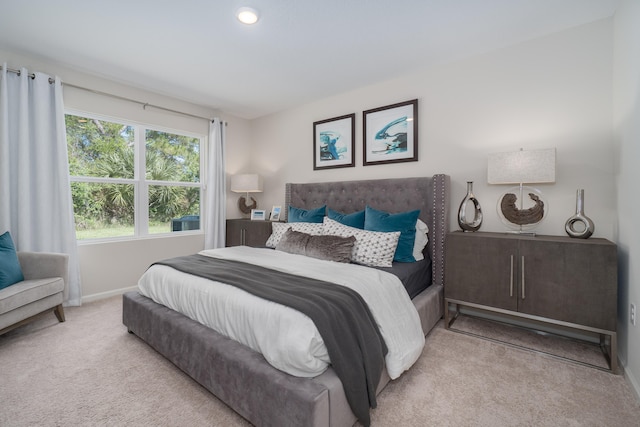 bedroom with light carpet