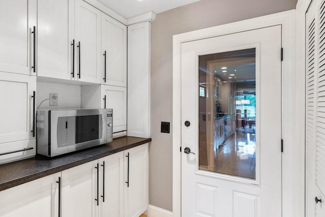 kitchen featuring white cabinetry