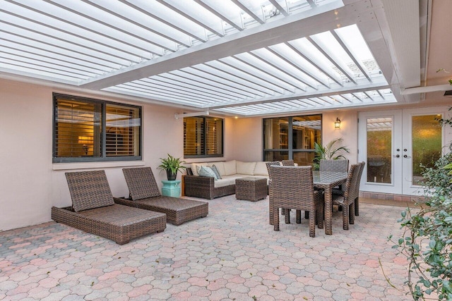 view of patio / terrace with a pergola, outdoor lounge area, and french doors