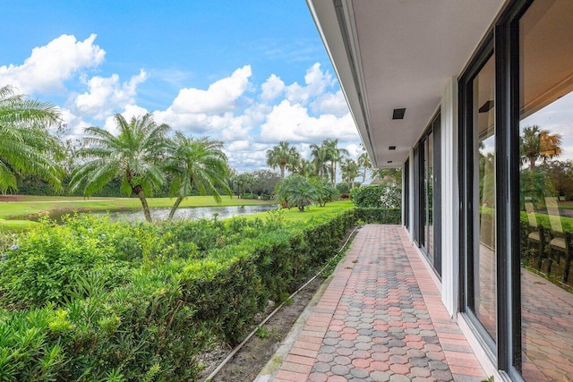 view of patio with a water view