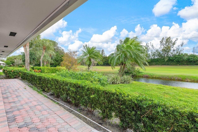 view of patio with a water view