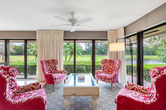 sunroom / solarium with plenty of natural light and ceiling fan