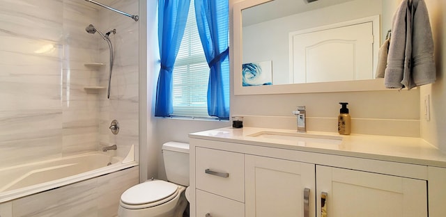 full bathroom featuring tiled shower / bath, vanity, and toilet