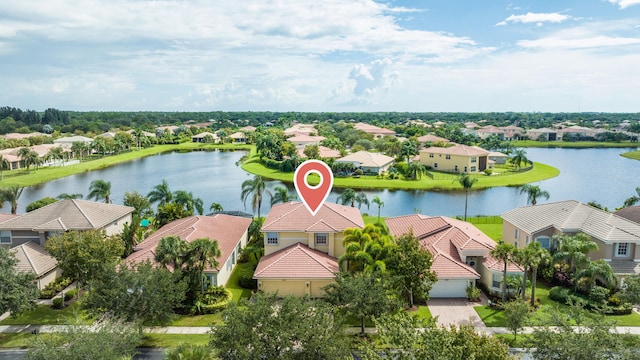 birds eye view of property featuring a water view