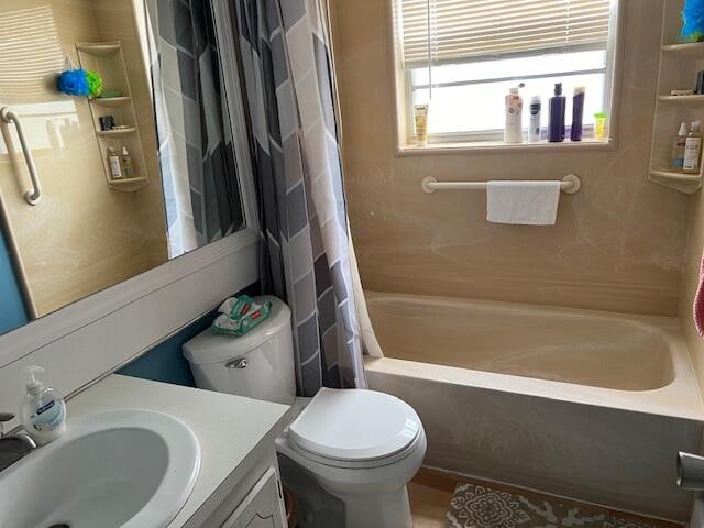 full bathroom with vanity, toilet, and shower / bathtub combination with curtain