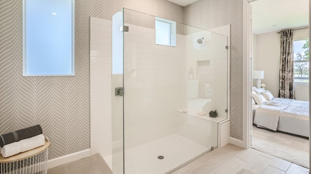 bathroom featuring a tile shower