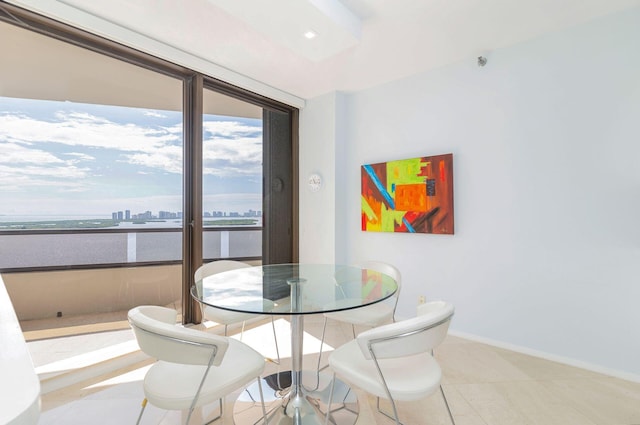 dining area featuring light tile patterned flooring