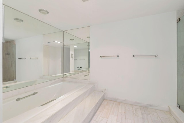 bathroom featuring vanity and separate shower and tub