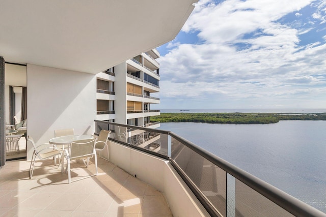 balcony featuring a water view