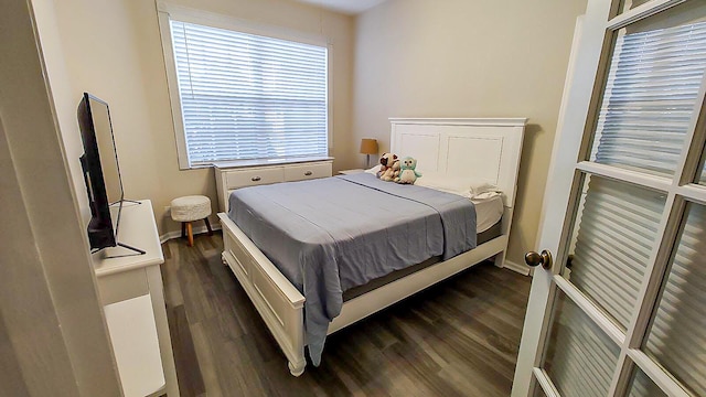 bedroom featuring dark wood-type flooring