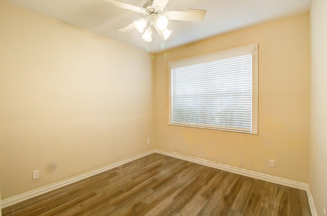 empty room featuring hardwood / wood-style flooring and ceiling fan