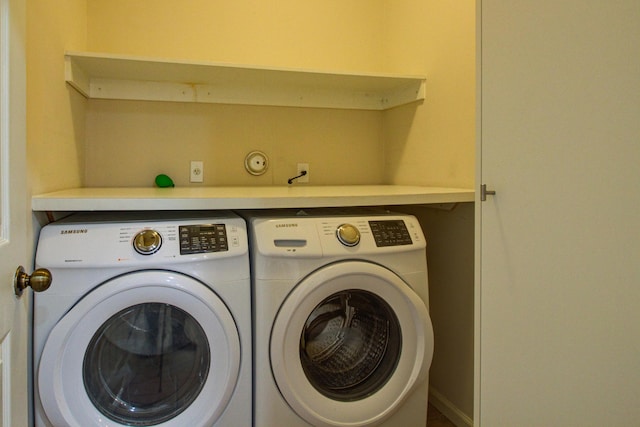 clothes washing area with independent washer and dryer