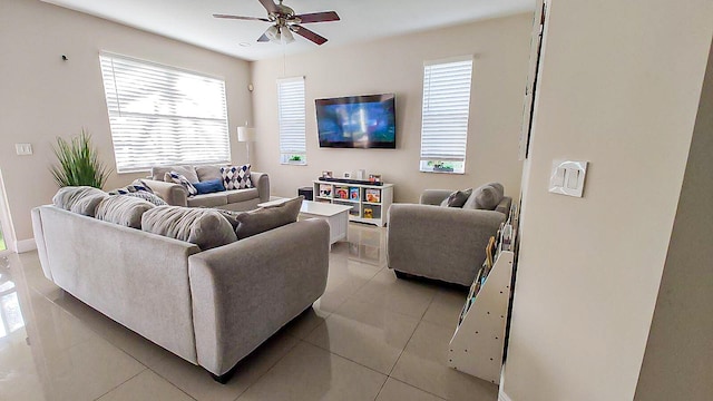 living room with ceiling fan and light tile patterned flooring