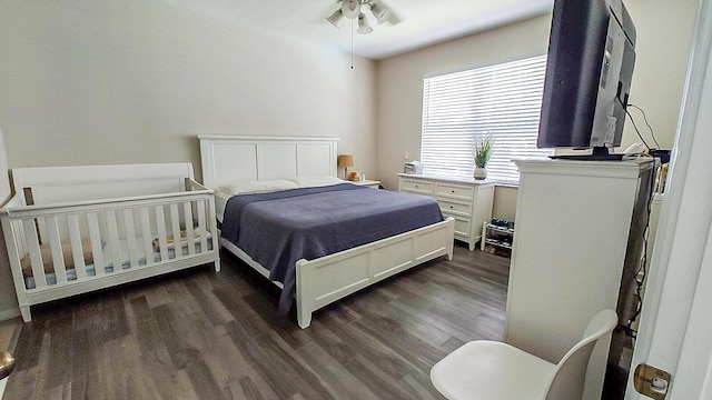 bedroom with dark wood-type flooring and ceiling fan