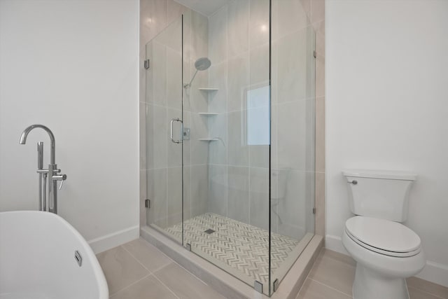 bathroom with walk in shower, tile patterned flooring, and toilet