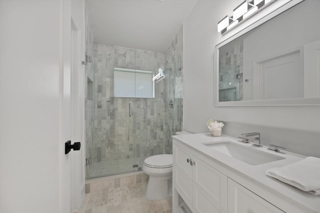 bathroom featuring walk in shower, vanity, and toilet