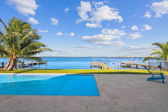 view of pool with a boat dock and a water view