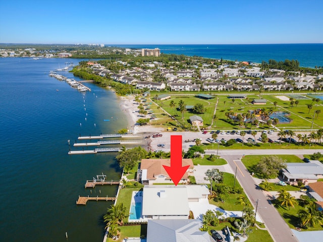 birds eye view of property featuring a water view